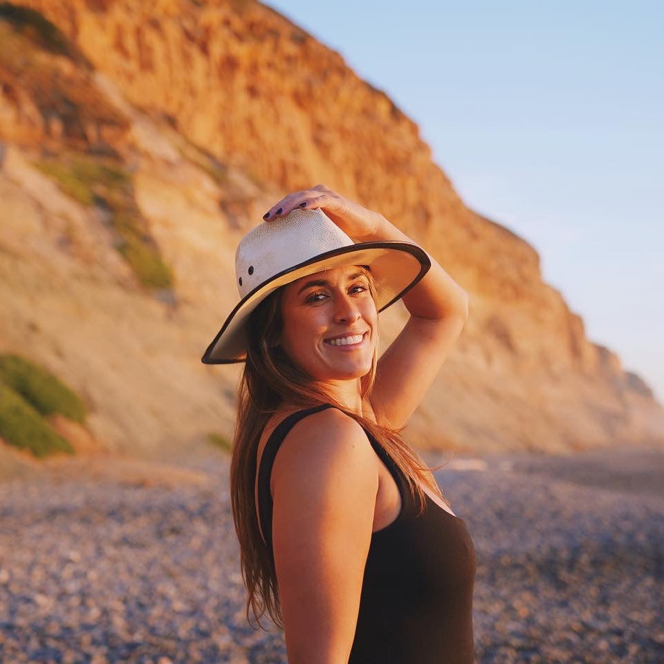 Viana Lora standing in front of a mountain - Stamps Tours