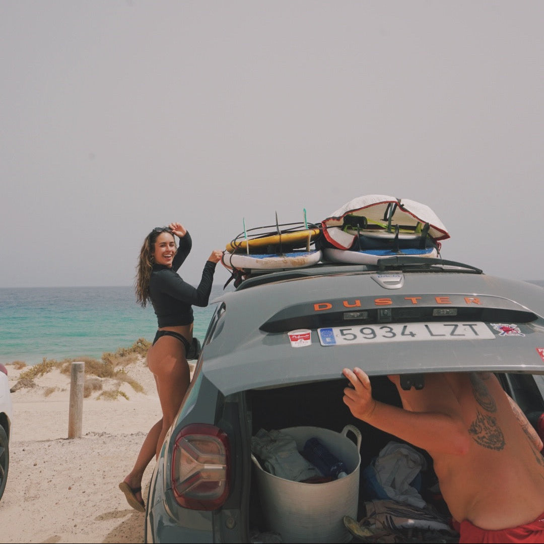 Viana Lora with surfing boards - Stamps Tours