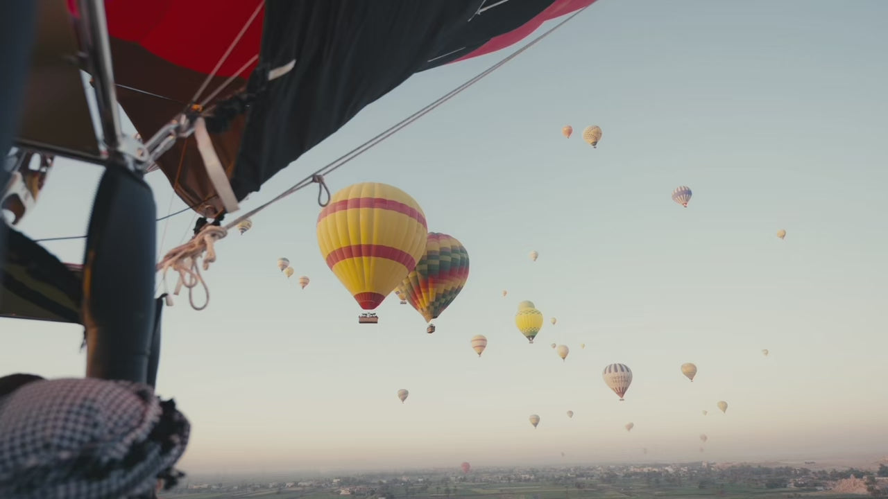 Load video: Stamps Tours sizzle reel featuring retreats, group tours, luxury tours, and events in Egypt, such as hot air balloon rides, meditation classes, yachting, and other adventures